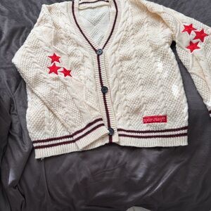 Taylor Swift Cream Cardigan with Red Star Accents